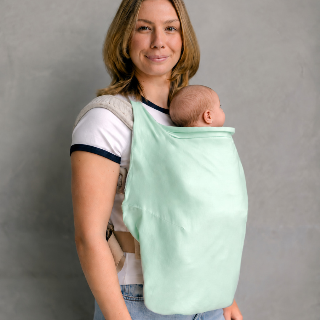 Mum babywearing with Gumnut Green Shady Baby UPF50+ carrier sun cover